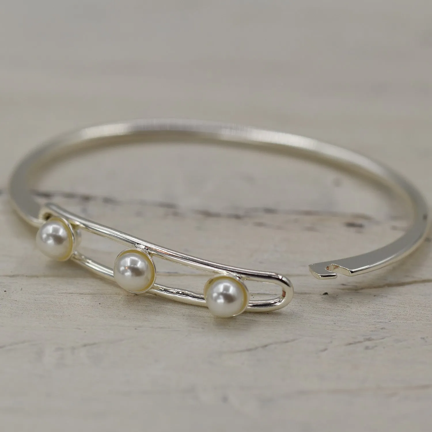Delicate hook over bangle with three pearls